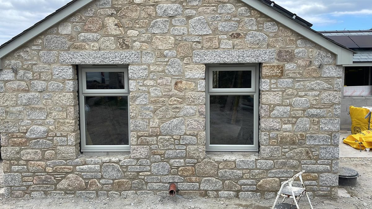 Cream uPVC windows fitted in a Cornish granite cottage