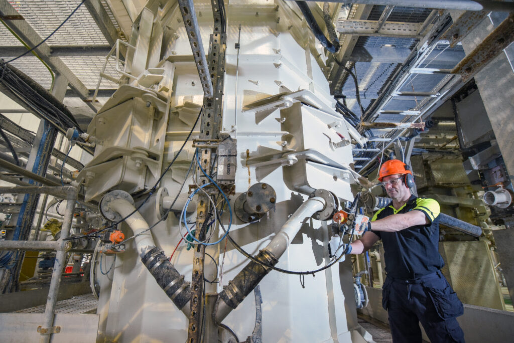 Engineer working on MFC production equipment