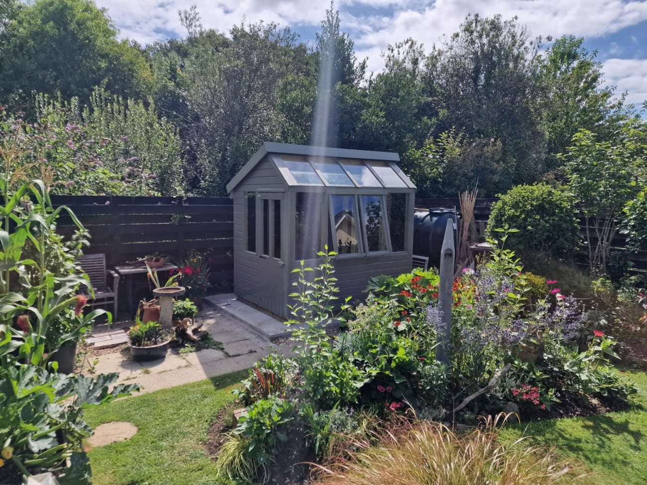 Apex potting shed in a cottage garden